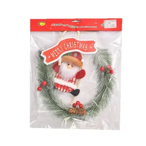 Christmas pine needle wreath with Santa Claus and red berries door hanging decoration