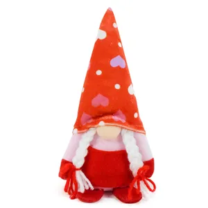Detailed view of Valentine's gnome plush with heart patterned hat and white braids