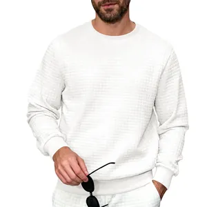 Close-up detail of white men's long sleeve crewneck sweatshirt with grid waffle texture