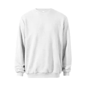 Close-up of white crewneck sweatshirt with distinctive small square waffle texture