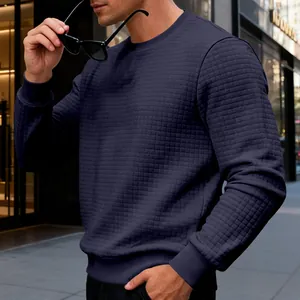 Close-up of men's navy sweatshirt with subtle waffle grid texture for casual wear.