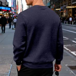 Detailed back view of men's navy blue sweatshirt featuring unique small waffle texture