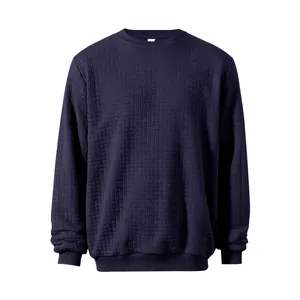 Detail of navy blue men's sweatshirt with square waffle texture and crewneck