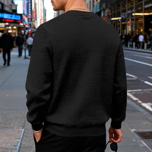 Men's black crewneck sweatshirt featuring a subtle square waffle texture pattern