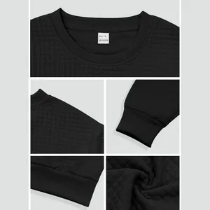 Macro view showing the detailed square grid texture of this black crew neck sweatshirt