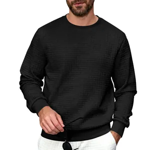 Close-up of black men's crew neck sweatshirt with distinctive waffle square texture