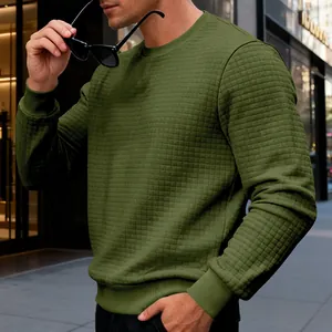 Detailed view of men's olive green sweatshirt featuring a unique grid texture.