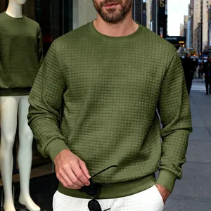 Detailed view of men's casual olive green sweatshirt featuring a small waffle grid texture