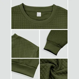Detail view of olive green sweatshirt showing small grid texture and ribbed cuffs