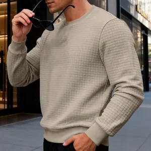 Close-up of men's casual long sleeve sweatshirt with waffle texture and crew neck.