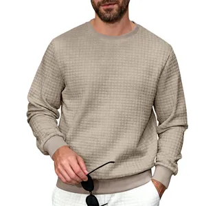 Macro detail of men's long sleeve crew neck sweatshirt with a textured waffle grid pattern