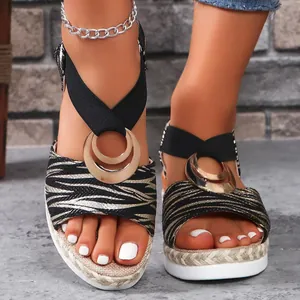 Stylish women's zebra pattern wedge sandals with gold ring buckle for summer leisure.