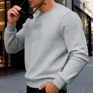 Detailed view of men's grey waffle texture crewneck sweatshirt with ribbed cuffs