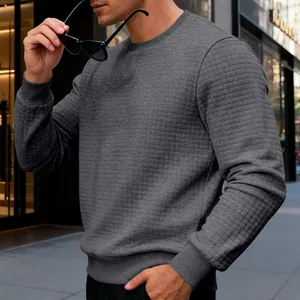 Detail view of men's grey long sleeve sweatshirt with waffle grid texture design