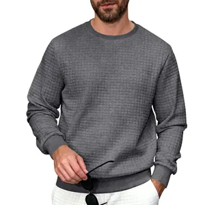 Detailed view of a grey men's crewneck sweatshirt with a quilted checkered texture.