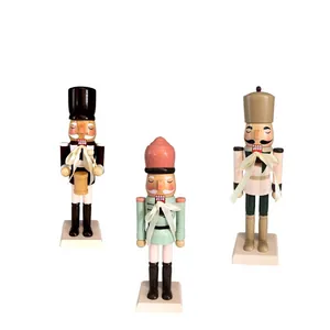 Three traditional 25cm handcrafted wooden nutcracker soldiers for festive Christmas decor