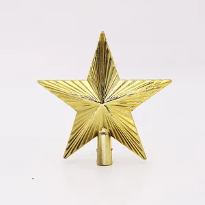 Detailed view of a golden five-pointed star Christmas tree topper with radial texture