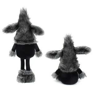 Detail of cute grey and black dog gnome plush dolls in standing and sitting poses