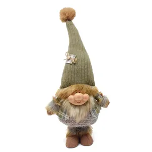 Detailed shot of a Nordic forest gnome doll with a chubby resin face and knit hat
