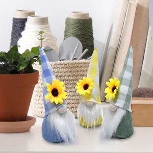 Three sunflower gnomes with plaid hats and white beards for spring home decoration