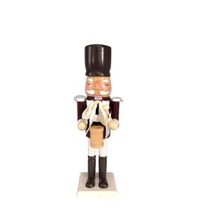 Detailed view of a 25cm wooden Nutcracker soldier figure with drum for Christmas decor