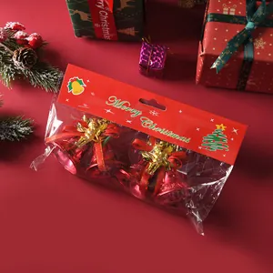 Detail view of 4.5cm red Christmas bells with gold angel ornaments for holiday decor