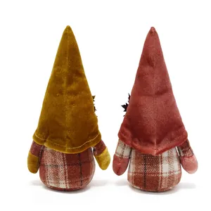 Detailed back view of autumn harvest gnomes featuring velvet hats and plaid fabric bodies