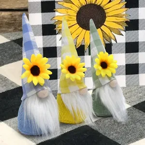 Detail view of three colorful sunflower gnomes with plaid hats and white beards