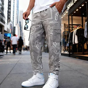 Grey paisley print cargo pants for men in a high street hip hop style outfit