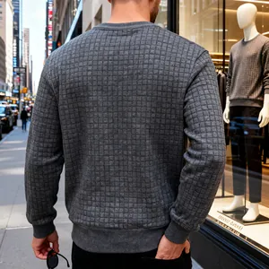Back view of men's grey waffle textured crew neck sweatshirt in an urban setting