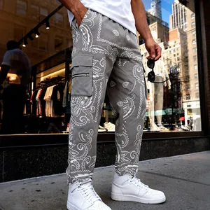 Men's grey cargo pants with white paisley pattern print in high street hip hop style