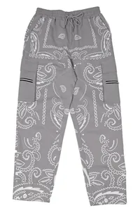 Front view of men's grey loose cargo pants featuring white paisley print and drawstring waist