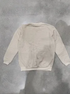 Detailed back view of men's beige waffle knit crewneck sweatshirt with grid texture