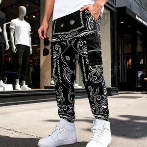Street style view of men's black bandana print cargo joggers with side pocket details