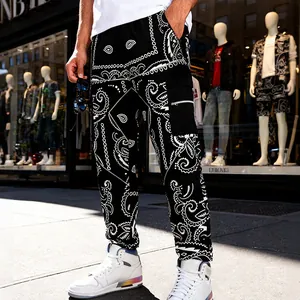 Detailed view of men's black paisley cargo pants featuring high street fashion style