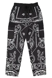 Detailed view of black men's cargo pants featuring white paisley print and zipper pockets