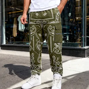 Street style detail of olive green paisley cargo pants with side pocket and zipper