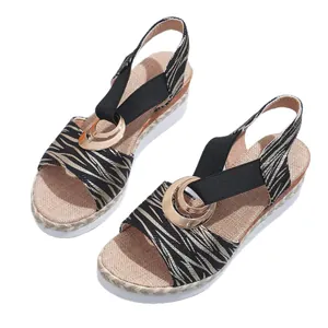 Stylish women's wedge sandals with zebra print straps and gold buckle decoration