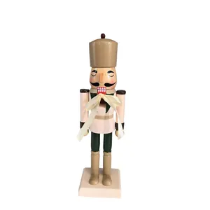 Detailed view of a 25cm handcrafted wooden nutcracker soldier ornament with a cream bow
