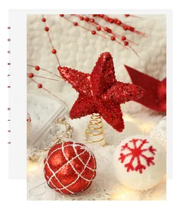 Detailed view of red glitter star tree topper and snowflake patterned Christmas ornaments