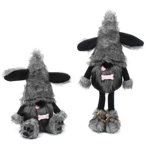 Detailed view of cute black dog gnome plush dolls with pink tongue and bone accents.