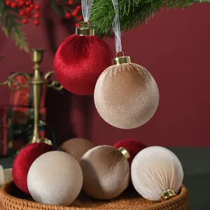 Macro view of velvet Christmas balls showing soft plush texture and golden hanging caps