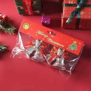 Silver electroplated Christmas bells with red ribbons and angel decor in packaging