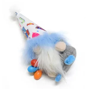 Close-up detail of a birthday gnome plush with a colorful party hat and soft fur