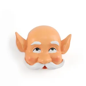 Macro detail view of a resin elf gnome face accessory with white beard and pointed ears