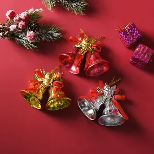 Detail shot of 4.5cm electroplated Christmas bells in red, gold, and silver