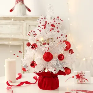 Mini white Christmas tree with red ornaments and Noel sign for desk decor