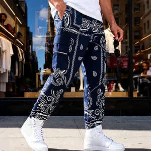 Close-up detail of men's blue bandana paisley cargo pants in high-street urban style