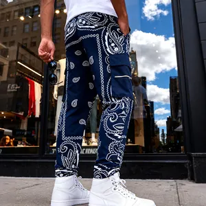 Detail view of men's high street navy blue bandana paisley print loose cargo pants