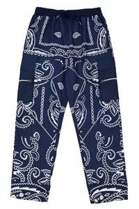 Detailed macro view of men's navy blue paisley cargo pants with white reflective piping.